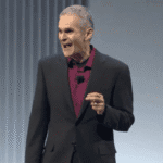 Alt text: Amin Vahdat, Google's new chief technologist for AI infrastructure, speaking at a conference.