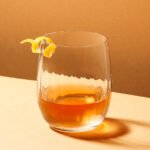 Illustration depicting the negative impact of alcohol on gut health, possibly showing a damaged gut lining or imbalanced microbes.