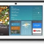 Alt text: Amazon Echo Show 15 with remote control and wall-mountable design.