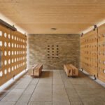 Architect Brent Buck in his office, surrounded by natural materials and unique objects.