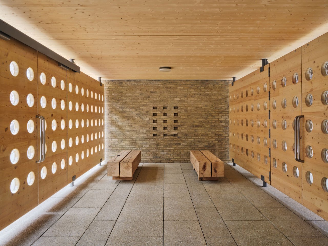 Architect Brent Buck in his office, surrounded by natural materials and unique objects.