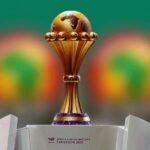 Les joueurs en action sur le terrain de la Coupe d'Afrique des Nations Maroc-2025.