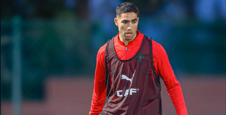 L'entraîneur national Walid Regragui et le joueur Achraf Hakimi.