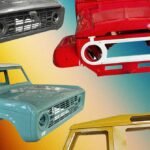 Alt text for the image: "Copycat vintage car-body shells on display at a motoring expo"