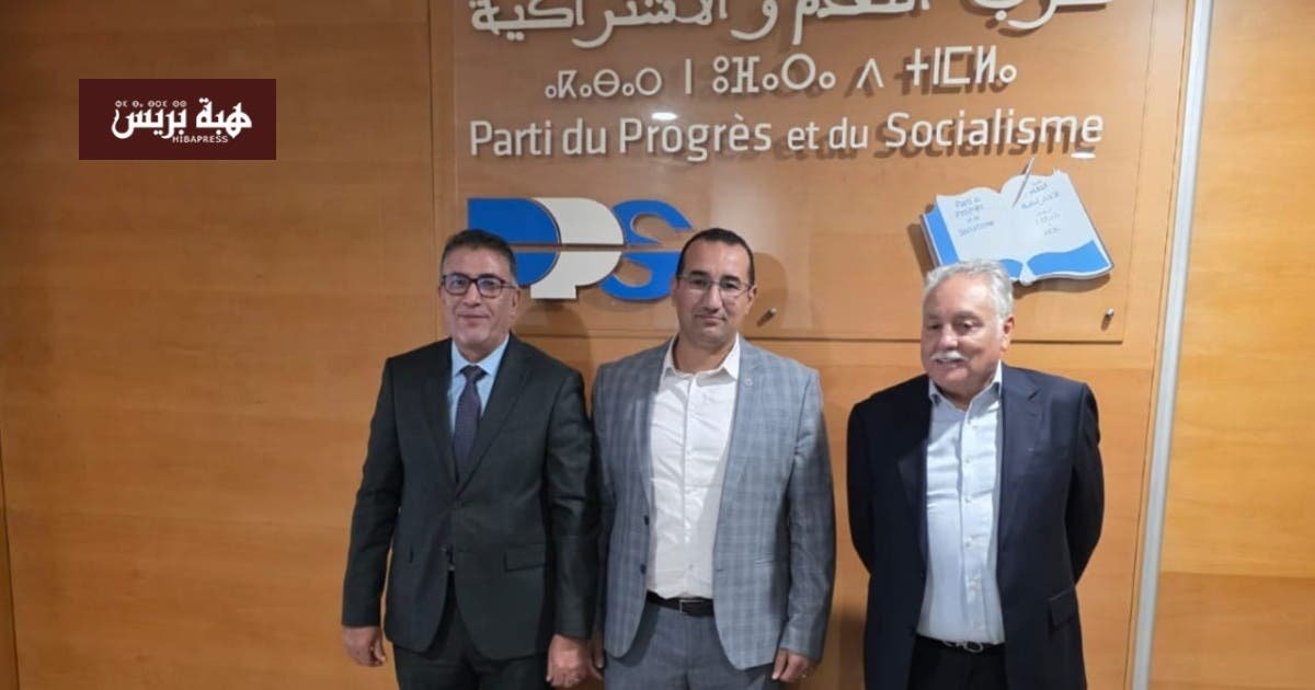 صورة بدر بنسعادة مع رشيد الحموني