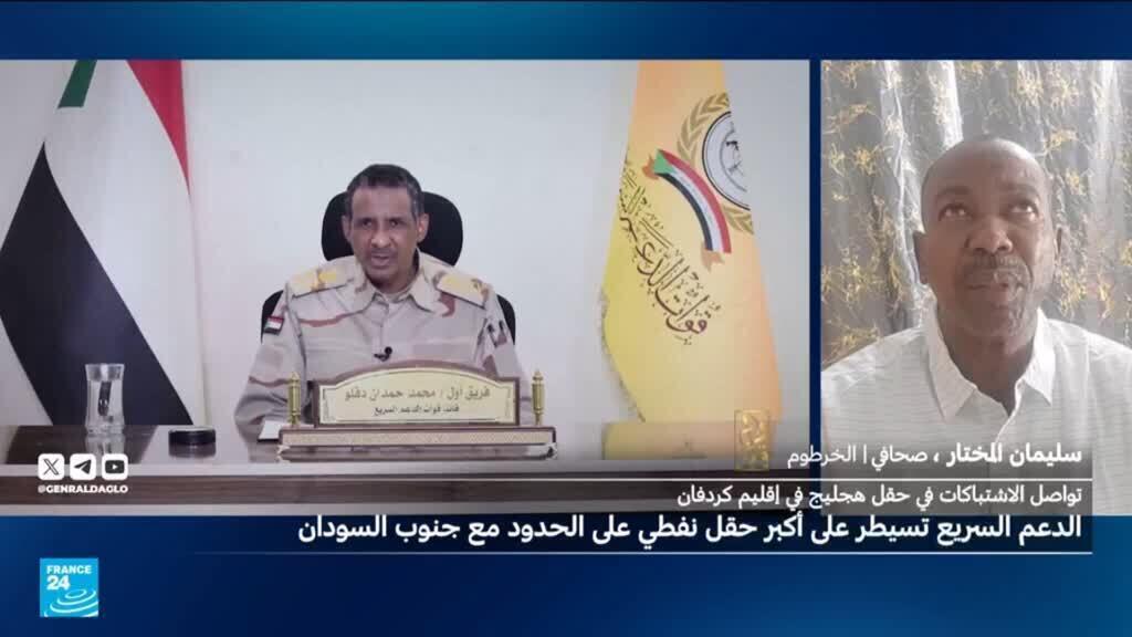 صورة لموقع الحقل النفطي في جنوب السودان، مع وابل من النيران في الخلفية.