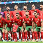 A Moroccan player in action during a football match.