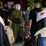 وصول لاجئين سوريين إلى مطار دمشق الدولي.