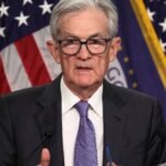 A stylized image of the Federal Reserve building with economic charts overlaid, symbolizing monetary policy decisions.