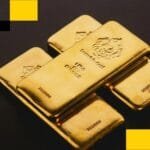 Alt text for the image: "Gold bars in a vault"