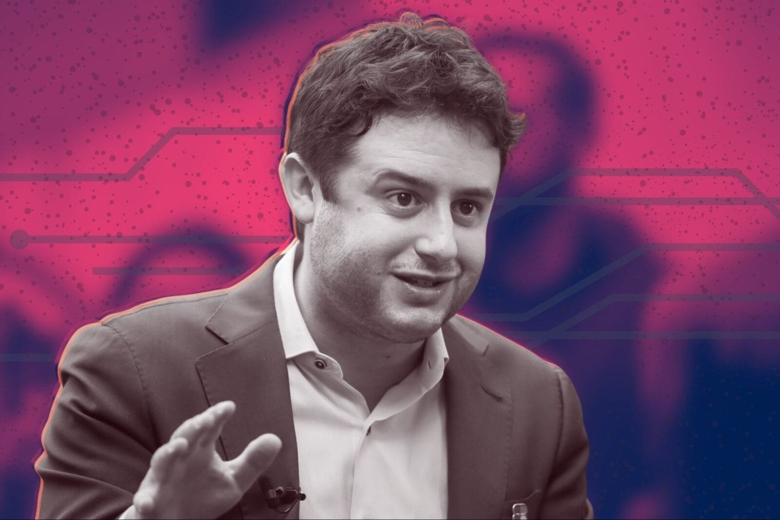 Dylan Field, CEO of Figma, speaking at a conference.