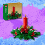 Lego Christmas Table Decoration building set with red candle, green foliage, and small white flowers.