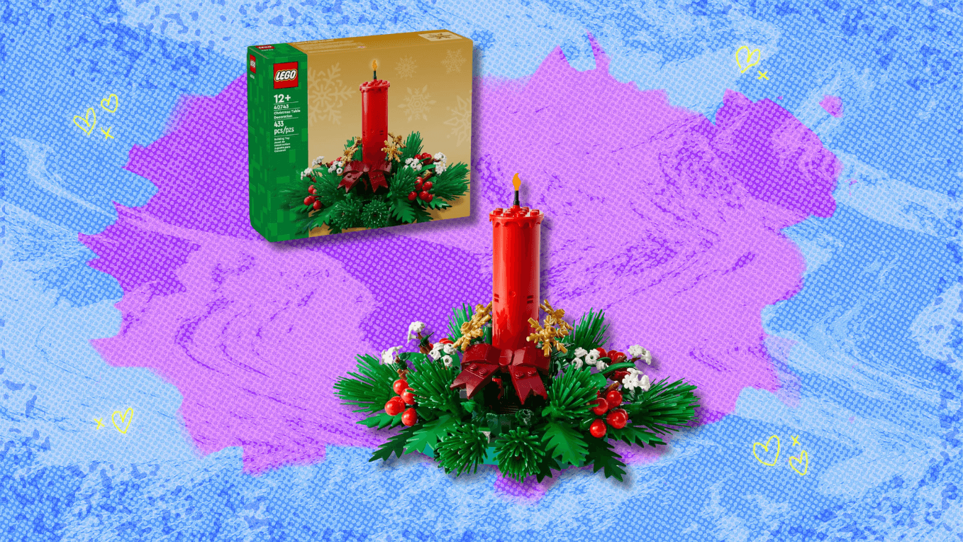 Lego Christmas Table Decoration building set with red candle, green foliage, and small white flowers.