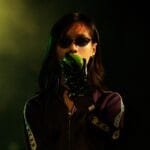 Alt text for the image: "Bi Gan on set with his cinematographer and production designer"