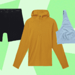 A person wearing a merino wool sweater, with a scenic background of mountains or a forest.