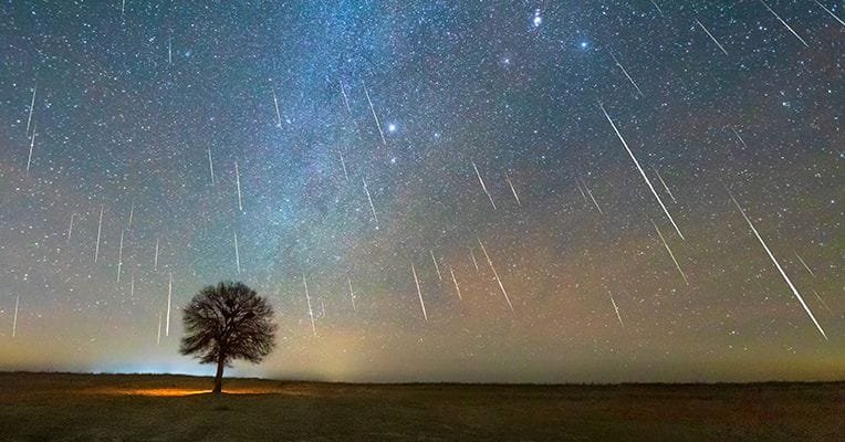 "A bright meteor streaking across a dark sky"