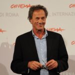 A photo of Mohammad Bakri, with a caption describing him as a Palestinian actor and filmmaker who challenged Israeli narratives through his work.