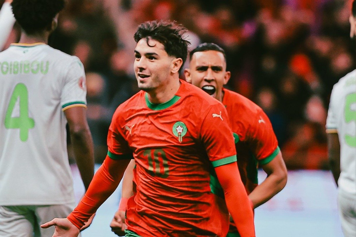 Morocco players celebrate victory over Comoros