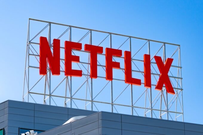 Alt text for the image: "Netflix logo and Warner Bros. logo side by side"