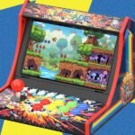 iMP Tech Mini Arcade Pro with Nintendo Switch inserted, showcasing its arcade cabinet design and joystick.