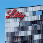 A person exercising with a healthy weight loss goal in the background