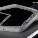 The OneXSugar Wallet retro gaming handheld with its foldable screen partially open, showcasing its unique design and controls.