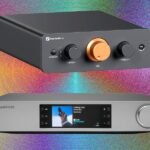 A sleek, modern preamplifier with various input selectors and a volume knob, connected to other audio components.