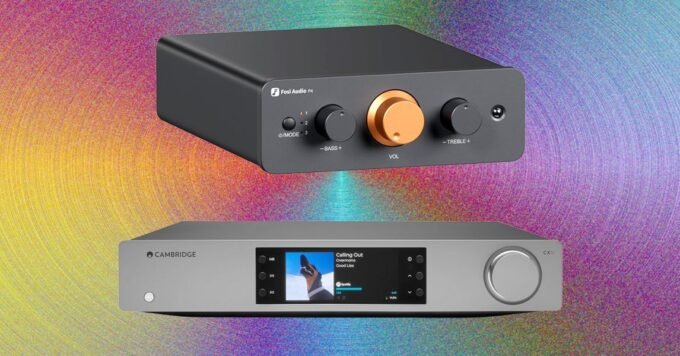 A sleek, modern preamplifier with various input selectors and a volume knob, connected to other audio components.