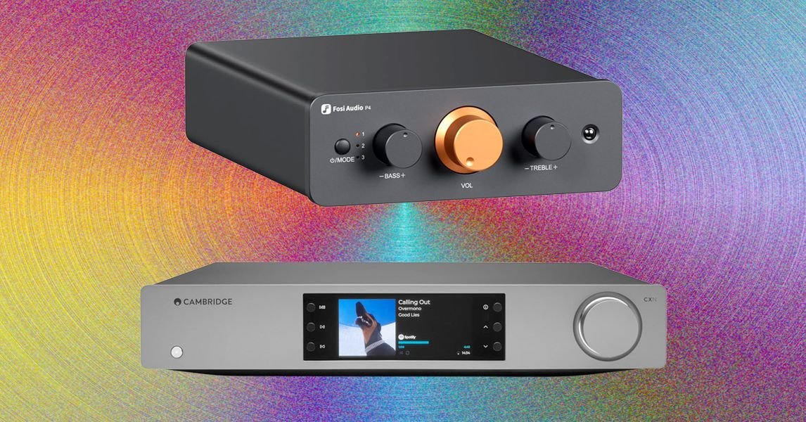 A sleek, modern preamplifier with various input selectors and a volume knob, connected to other audio components.