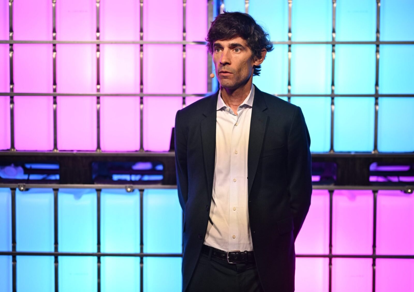 Nick Thompson running in a park, with a determined look on his face.