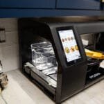 Alt text for the image: "Robot Chef Cooking Dinner"