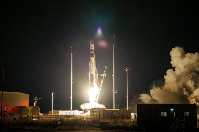 Rocket Lab's logo and a satellite in space