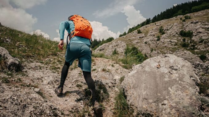 Weighted backpack on a hiker's back