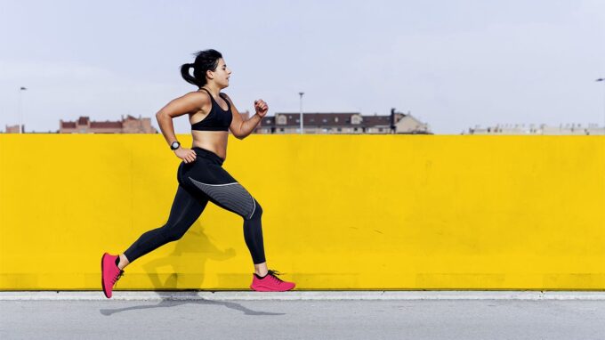 A runner experiencing a side stitch during exercise.