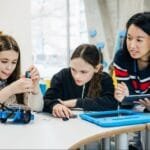 A group of children participating in a hands-on STEM activity with a High Touch-High Tech franchisee.