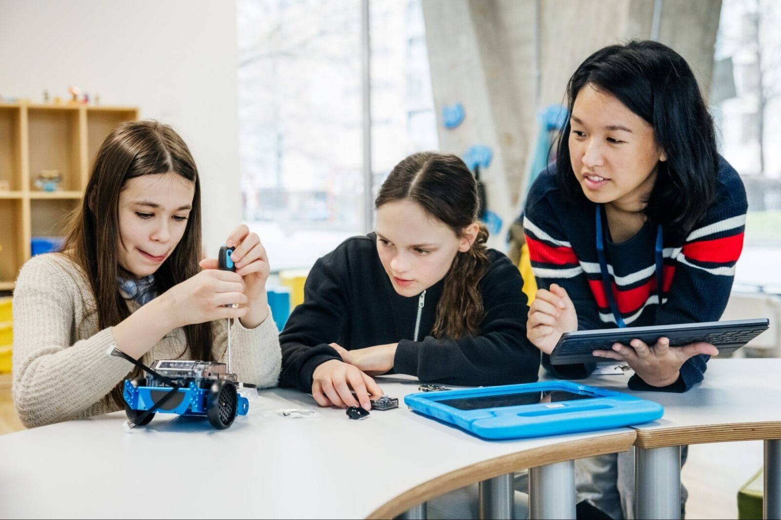 A group of children participating in a hands-on STEM activity with a High Touch-High Tech franchisee.