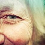 A diverse group of happy older adults enjoying activities in a vibrant, age-friendly community park.