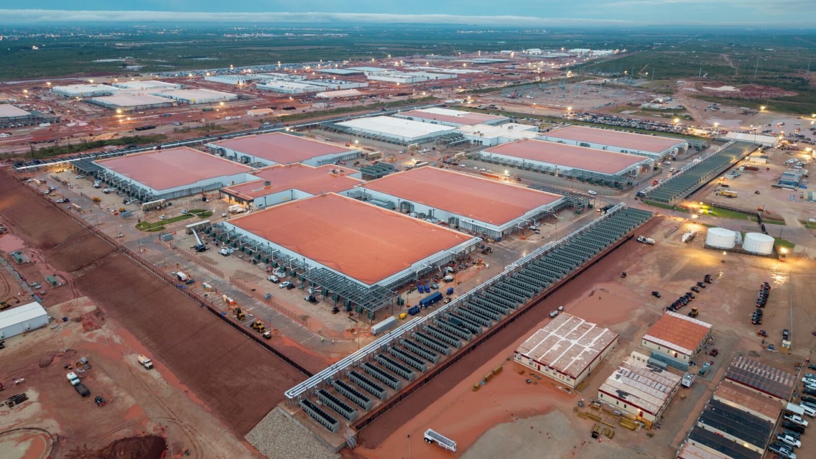 Construction site of OpenAI's Stargate AI data center in Abilene, Texas, showing vast scale and dusty conditions.