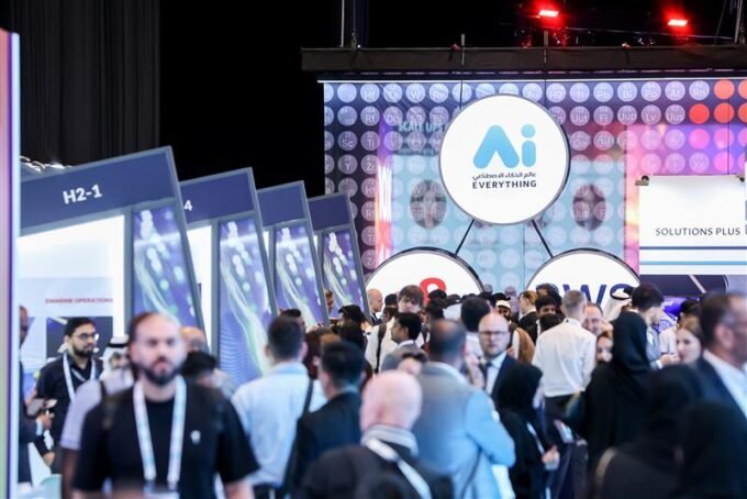 Attendees at AI Everything MEA Egypt 2026 interacting with advanced AI systems and exhibits.