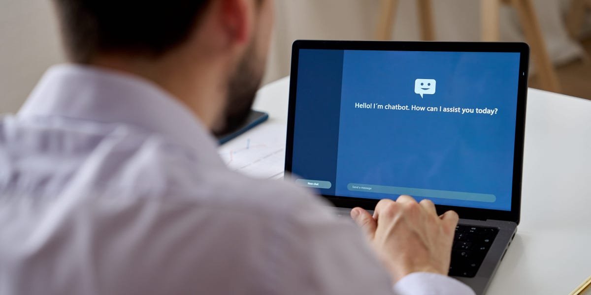 A professional individual confidently using a laptop with AI-related graphics, symbolizing career growth and technological advancement.