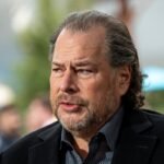 Salesforce CEO Marc Benioff speaking at a conference, discussing AI regulation and its societal impact.