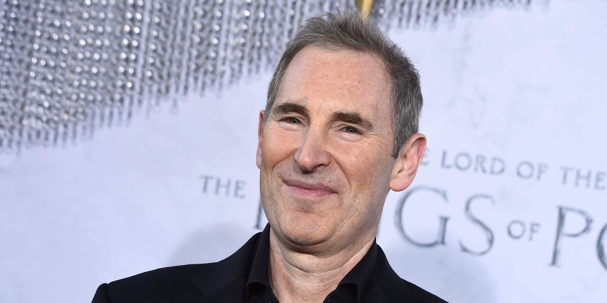 Amazon employees discussing layoffs, with a subtle nod to Jeff Bezos' 2-pizza rule