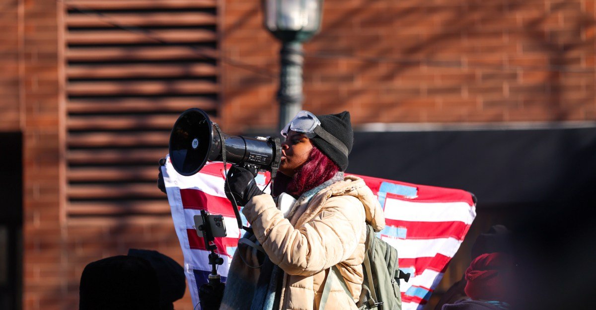 Protestors demonstrating against ICE with signs in a city street, photo by Steven Garcia / The Verge.