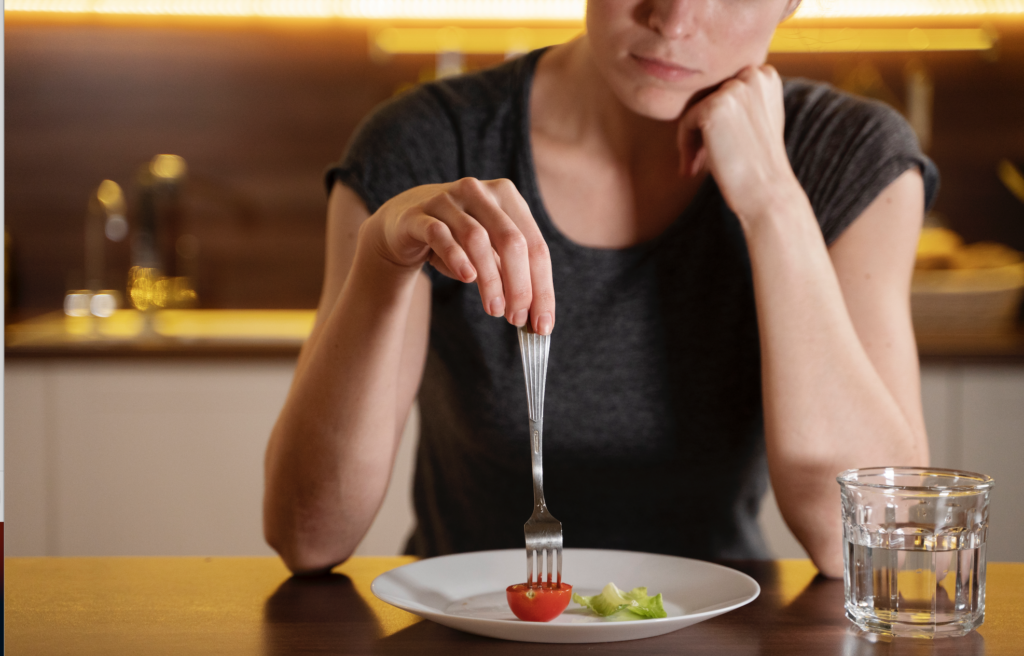 A person holding a healthy snack, symbolizing mindful eating and successful appetite control.