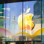 Apple's Stellar Quarter: iPhone Dominance Defies AI Hype and Market Skepticism 6 Apple iPhone in hand, symbolizing strong sales and financial performance