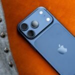 Apple Shatters Records: iPhone Revenue Soars Amidst AI Ambitions 8 Apple iPhone 17 Pro with financial charts in the background