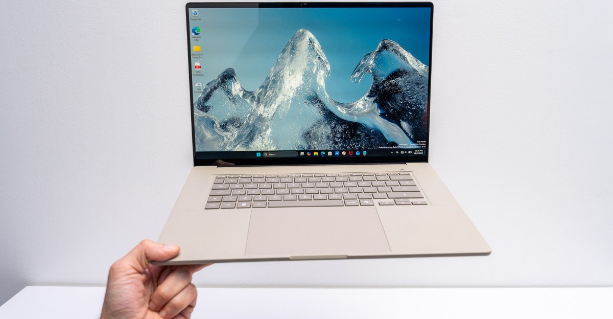 Asus Zenbook A16: The Featherlight 16-inch Laptop Redefining Portability at CES 2026 3 A sleek, thin Asus Zenbook A16 laptop in an earthy beige color, showcasing its large OLED display.