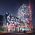 Gaming Getaway Grounded: Atari Hotel Las Vegas Plans Scrapped Amidst Delays 6 A conceptual rendering of an Atari-themed hotel exterior, possibly with retro gaming elements and a futuristic design.