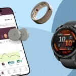 A selection of modern fitness trackers and smart rings, including Garmin Vivoactive and Oura Ring, displayed on a clean surface.