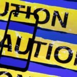 Screenshot of a phone displaying a fraudulent Betterment notification about a crypto scam, with Bitcoin and Ethereum logos.